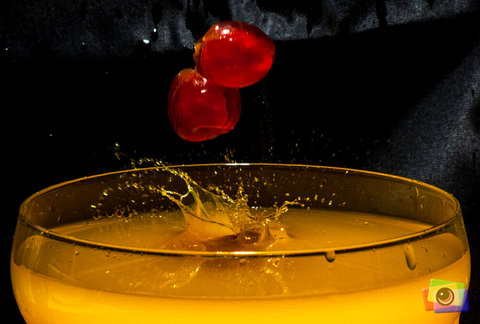 Cherries into coloured water.